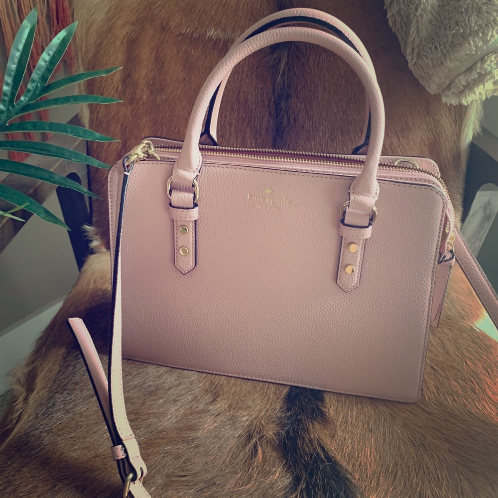 Pink Kate Spade handbag with crossbody strap